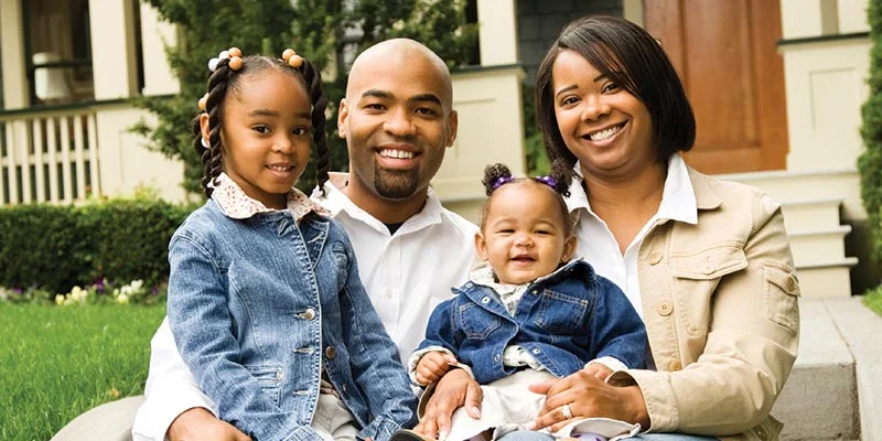 Family On House Steps | Gary Denney Floor Covering & Carpet Warehouse | The Dalles, Oregon